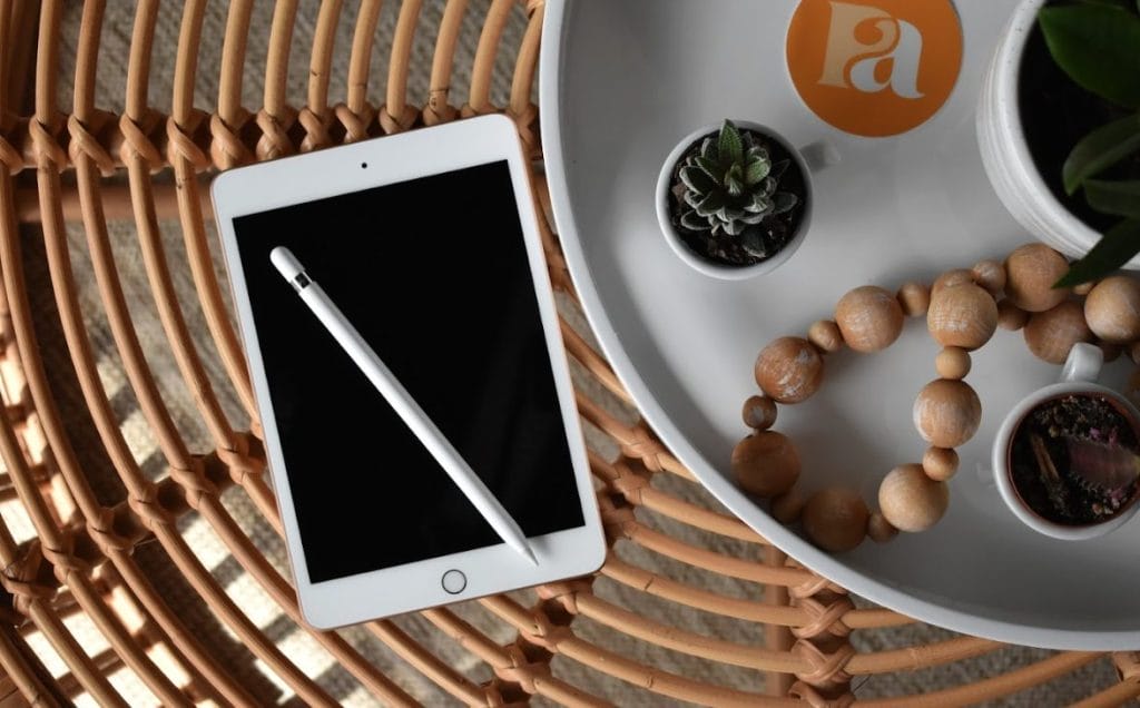 AI-generated image of an individual sitting at a computer with documents sitting around him; Email marketing fatigue