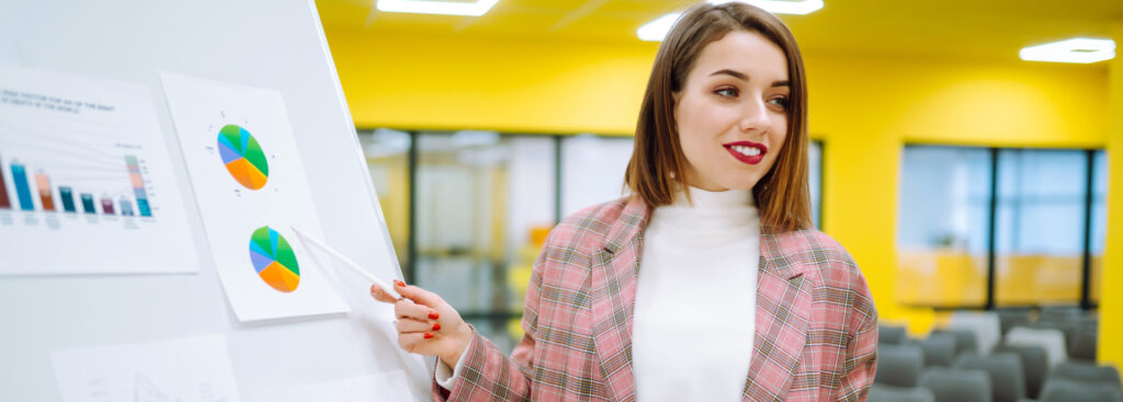 Person points to graph during a presentation