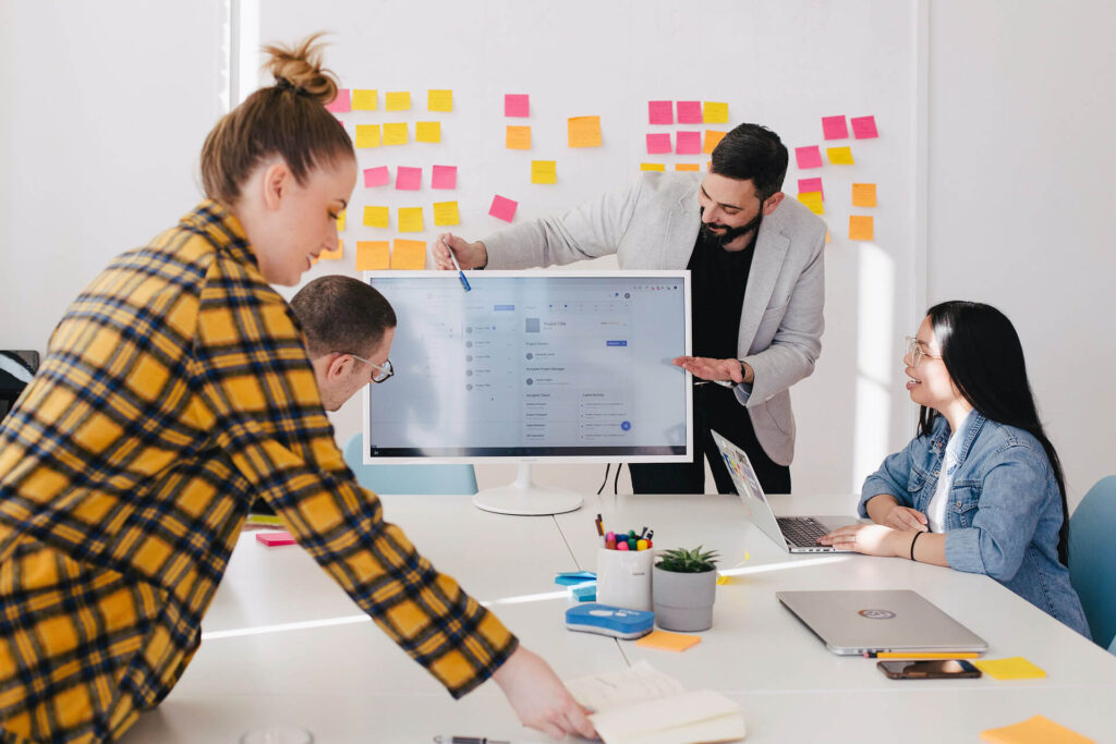 A team working on a large project | 7 Digital Marketing Tips for Businesses